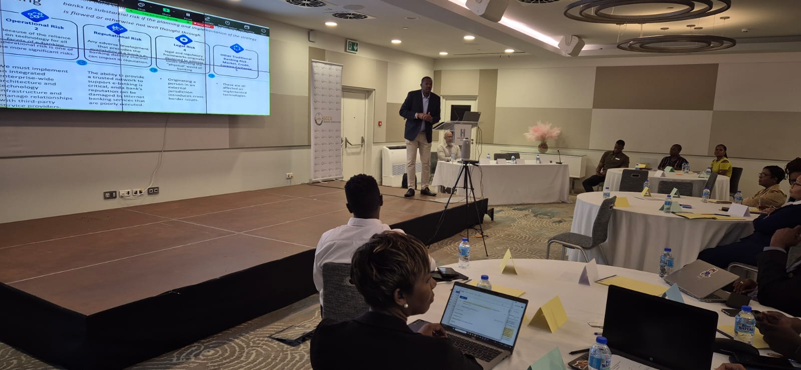 Presenter leading a session at a regional banking workshop